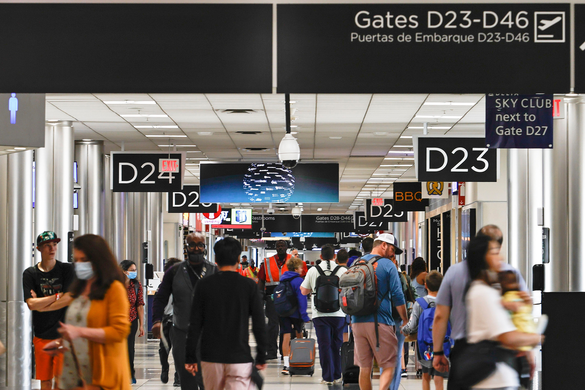 Passengers walk through Concourse D at Hartsfield-Jackson International Airport on Thursday, July 7, 2022.