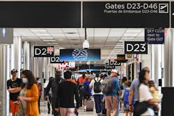 Passengers walk through Concourse D at Hartsfield-Jackson International Airport on Thursday, July 7, 2022.