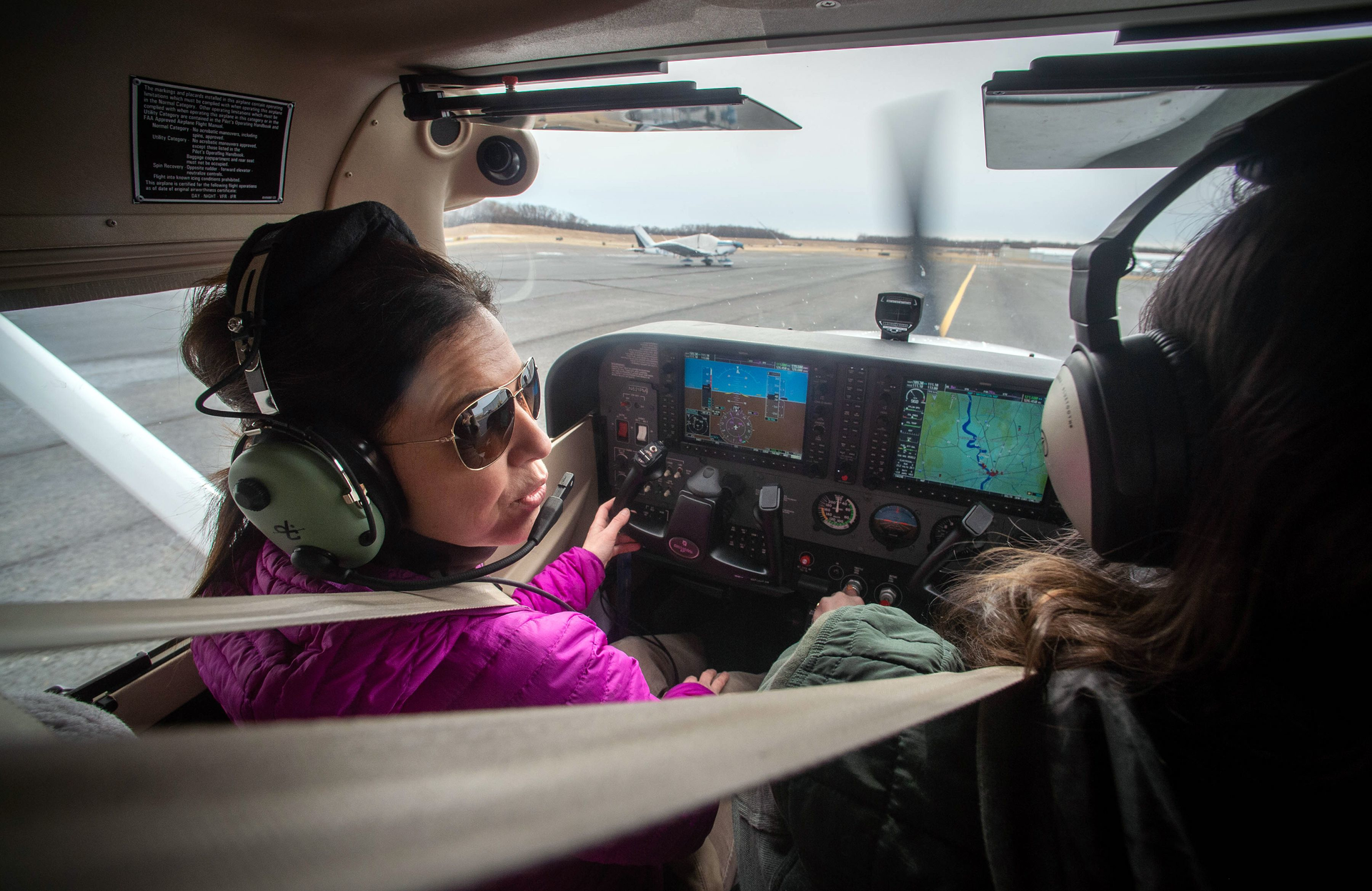 Learn 2 Fly CT student Sophie Belanger left, talks with her flight instructor Arianna Strand as they taxi around the runway last week in a Cessna 172 Skyhawk at Hartford-Brainard Airport.