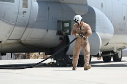 A U.S. Marine Corps KC-130J Super Hercules crew member prepares to conduct a refueling operation in support of a simulated Forward Arming and Refueling Point exercise at Chabelley Airfield, Djibouti, Feb. 22, 2023. The FARP mission enables aircraft supporting combat operations to refuel much closer to their area of operation, saving a significant amount of time.