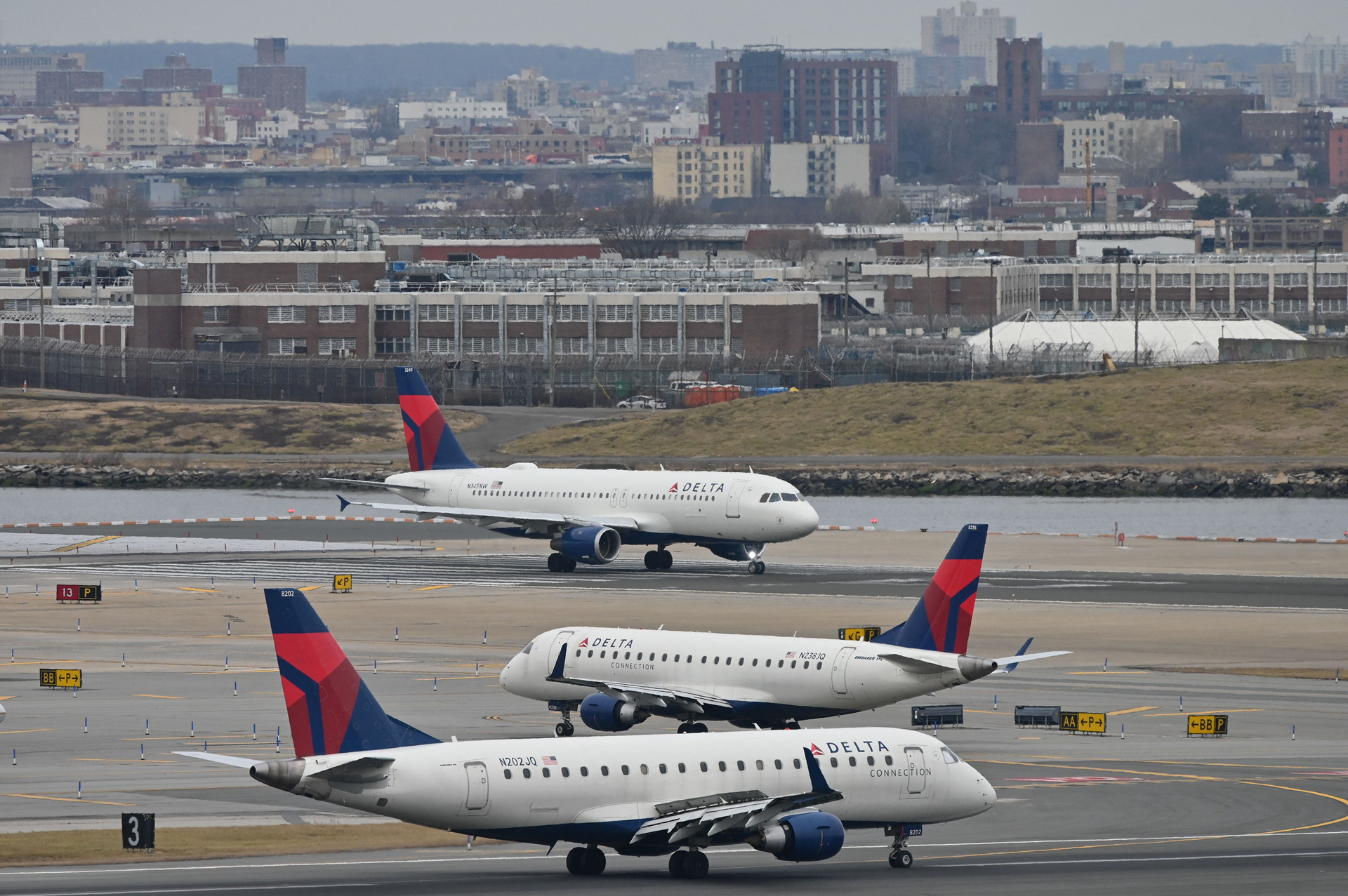 Delta Airlines planes taxi at LaGuardia airport in New York on Jan. 11, 2023. On Wednesday, Delta launched free WiFi on 75% of its domestic mainline aircraft.