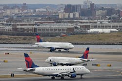 Delta Airlines planes taxi at LaGuardia airport in New York on Jan. 11, 2023. On Wednesday, Delta launched free WiFi on 75% of its domestic mainline aircraft.