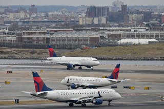 Delta Airlines planes taxi at LaGuardia airport in New York on Jan. 11, 2023. On Wednesday, Delta launched free WiFi on 75% of its domestic mainline aircraft.
