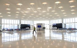 Dan Buchman walks through the newly expanded Terminal 5 at O&apos;Hare International Airport on Jan. 31, 2023. The expansion includes 350,000 square feet of vaulted ceilings, natural light, and floor-to-ceiling high-performance glass offering an expansive view of the airfield.