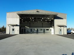 Home of two Bell 407 helicopters, the 5,500-square-foot hangar has a 65-foot by 70-foot main floor, epoxy-coated over an 8-inch slab on concrete with embedded grounding pins to dissipate any static buildup generated by the helicopter. Home of two Bell 407 helicopters, the 5,500-square-foot hangar has a 65-foot by 70-foot main floor, epoxy-coated over an 8-inch slab on concrete with embedded grounding pins to dissipate any static buildup generated by the helicopter.