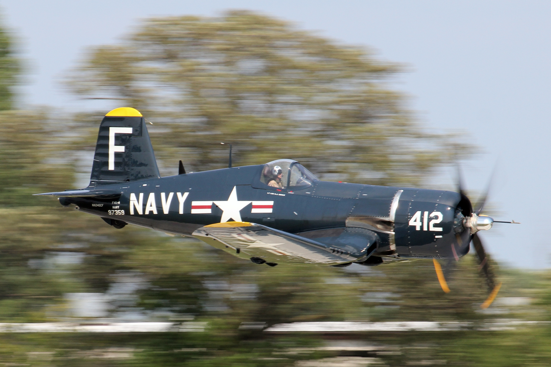 A Corsair in flight during EAA AirVenture Oshkosh 2021.