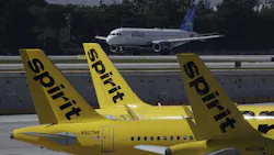 A JetBlue airliner takes off past Spirit Airlines planes parked at Fort Lauderdale-Hollywood International Airport. The federal government is suing to block Spirit's takeover by JetBlue, which hopes a settlement with the state of Florida will help pave the way for a resolution. A JetBlue airliner takes off past Spirit Airlines planes parked at Fort Lauderdale-Hollywood International Airport. The federal government is suing to block Spirit's takeover by JetBlue, which hopes a settlement with the state of Florida will help pave the way for a resolution.