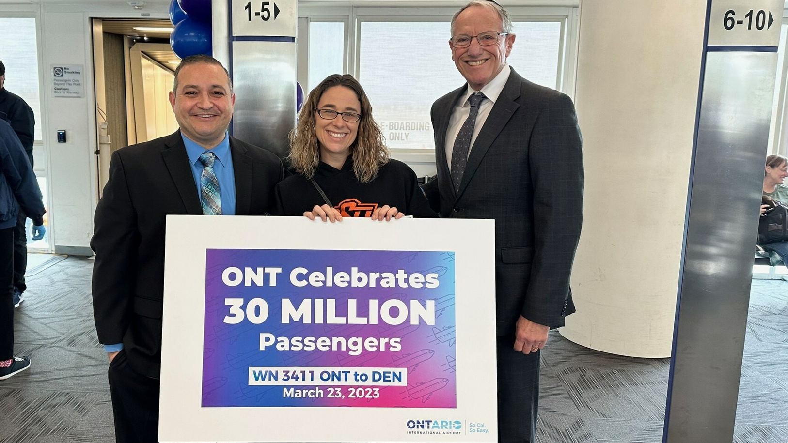 From left: Atif Elkadi, CEO, Ontario International Airport Authority (OIAA); 30 millionth passenger Jessica Burchett; Alan D. Wapner, president, OIAA