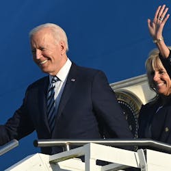 U.S. President Joe Biden, left, and first lady Jill Biden disembark from Air Force One on their arrival at Royal Air Force Mildenhall, England on Wednesday, June 9, 2021, ahead of the three-day G7 Summit. Air Force One is getting a paint job, and it resembles the iconic appearance of old.
