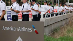 American Airlines pilots with the Allied Pilots Association stand along Trinity Boulevard during an informational picket in front of American Airlines Headquarters in Fort Worth, Thursday, Sept. 1, 2022.