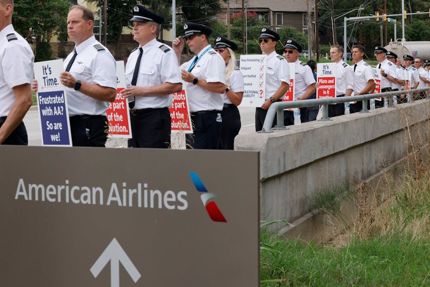 American Airlines pilots with the Allied Pilots Association stand along Trinity Boulevard during an informational picket in front of American Airlines Headquarters in Fort Worth, Thursday, Sept. 1, 2022.
