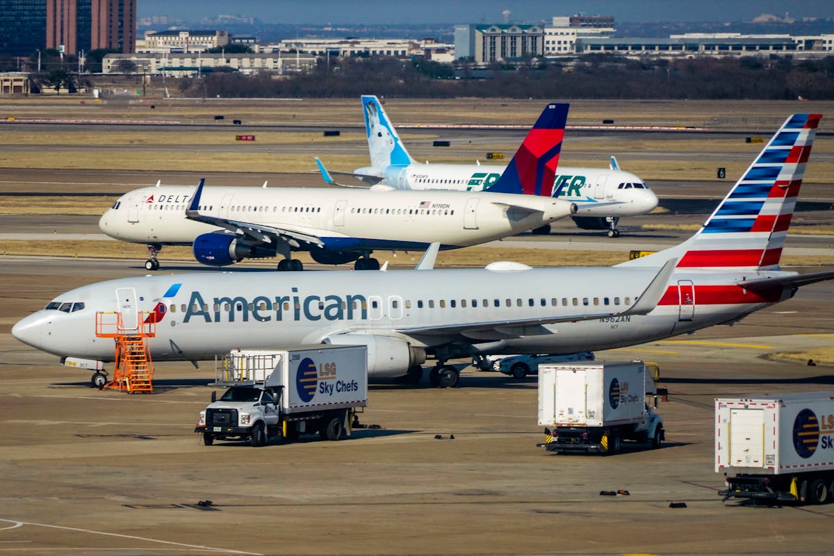 American Airlines, Delta Airline and Frontier Airlines aircraft are seen on the ramp and taxiways at DFW Airport on Sunday, March 13, 2022.