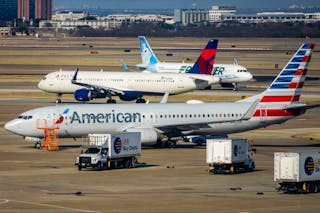 American Airlines, Delta Airline and Frontier Airlines aircraft are seen on the ramp and taxiways at DFW Airport on Sunday, March 13, 2022.