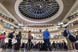 People gather in line at the Hartsfield-Jackson Atlanta International Airport on Monday, March 27, 2023.