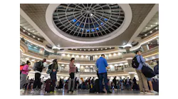 People gather in line at the Hartsfield-Jackson Atlanta International Airport on Monday, March 27, 2023.