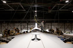Airmen from the 60th Maintenance Squadron and 349th Maintenance Squadron prepare the wing surface of a C-5M Super Galaxy prior to maintenance at Travis Air Force Base, Calif., Jan. 31, 2023. Maintainers modified an aerodynamic fairing over a wing splice of a C-5M Super Galaxy incorporating newly printed 3D parts known as blocks and wedges. Airmen from the 60th Maintenance Squadron and 349th Maintenance Squadron prepare the wing surface of a C-5M Super Galaxy prior to maintenance at Travis Air Force Base, Calif., Jan. 31, 2023. Maintainers modified an aerodynamic fairing over a wing splice of a C-5M Super Galaxy incorporating newly printed 3D parts known as blocks and wedges.
