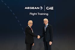 AEGEAN’s CEO Dimitrios Gerogiannis and CAE’s Group President, Civil Aviation, Nick Leontidis shake hands at an event to announce a joint venture between AEGEAN and CAE to open a new training center in Athens, Greece. AEGEAN’s CEO Dimitrios Gerogiannis and CAE’s Group President, Civil Aviation, Nick Leontidis shake hands at an event to announce a joint venture between AEGEAN and CAE to open a new training center in Athens, Greece.