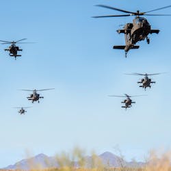 AH-64 Apaches perform a flyover at the Boeing Mesa site in Arizona.