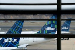 JetBlue planes sit at Ronald Reagan Washington National Airport in Arlington, Virginia, on Jan. 18, 2022. JetBlue planes sit at Ronald Reagan Washington National Airport in Arlington, Virginia, on Jan. 18, 2022.