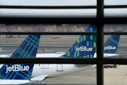 JetBlue planes sit at Ronald Reagan Washington National Airport in Arlington, Virginia, on Jan. 18, 2022.