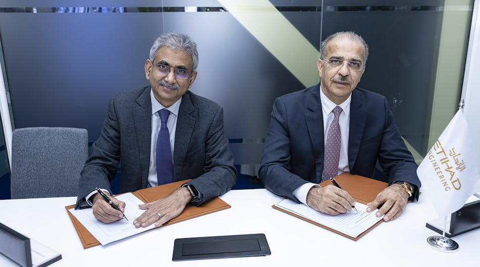 Venketrama Raja, chairman, Ramco Systems with Abdul Khaliq Saeed, CEO, Etihad Airways Engineering, during the signing ceremony at the 2023 MRO Middle East, Dubai.
