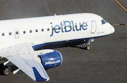 A JetBlue jet moves along the runway at Laguardia AIrport on Nov. 10, 2022, in New York. A JetBlue jet moves along the runway at Laguardia AIrport on Nov. 10, 2022, in New York.