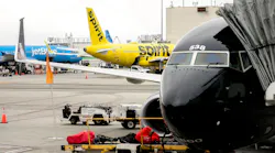 A JetBlue airplane and Spirit Airlines airplane sit at Los Angeles International Airport in Los Angeles, California, on March 13, 2023.