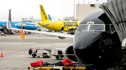 A JetBlue airplane and Spirit Airlines airplane sit at Los Angeles International Airport in Los Angeles, California, on March 13, 2023. A JetBlue airplane and Spirit Airlines airplane sit at Los Angeles International Airport in Los Angeles, California, on March 13, 2023.