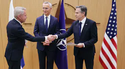 Finnish Foreign Affairs Minister Pekka Haavisto (L) shakes hands with US Secretary of State Antony Blinken, flanked by NATO Secretary-General Jens Stoltenberg (C) as he hands over Finland's accession to NATO documents, during a joining ceremony at a NATO - North Atlantic Council (NAC) Foreign Affairs ministers' meeting, at the NATO headquarters in Brussels, on April 4, 2023. - Finland on April 4 became the 31st member of NATO, wrapping up its historic strategic shift with the deposit of its accession documents to the alliance.