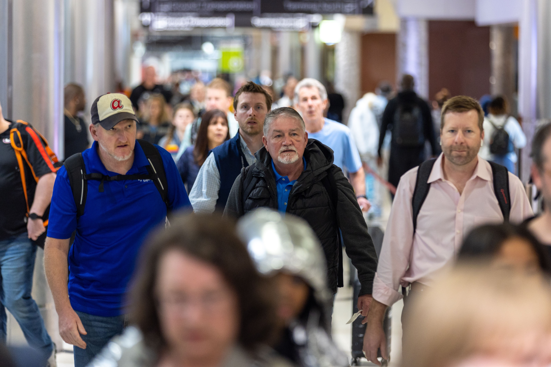 People walk through the Hartsfield-Jackson Atlanta International Airport on Monday, March 27, 2023.