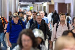 People walk through the Hartsfield-Jackson Atlanta International Airport on Monday, March 27, 2023.