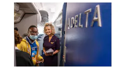 Participants walk onto a Delta Airlines jet during A Wings For All event at the Hartsfield-Jackson Atlanta International Airport Thursday, Apr. 11, 2023