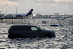 Flooding lingered at Fort Lauderdale-Hollywood International Airport on Thursday after heavy rain pounded South Florida. Over 26 inches of rain fell in South Florida since Monday, causing airport retention ponds to overflow and inundate the runways.