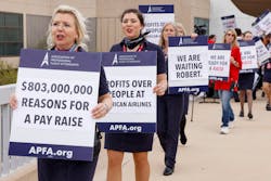 Members of the Association of Professional Flight Attendants picketed at Dallas/Fort Worth International Airport's Terminal A on Tuesday, April 4, 2023. The union, which represents over 25,000 American Airlines flight attendants, are seeking pay raises and better scheduling. The sign indicating '$803,000,000 reasons for a pay raise' refers to the Fort Worth carriers fourth-quarter profit.