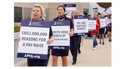Members of the Association of Professional Flight Attendants picketed at Dallas/Fort Worth International Airport's Terminal A on Tuesday, April 4, 2023. The union, which represents over 25,000 American Airlines flight attendants, are seeking pay raises and better scheduling. The sign indicating '$803,000,000 reasons for a pay raise' refers to the Fort Worth carriers fourth-quarter profit.