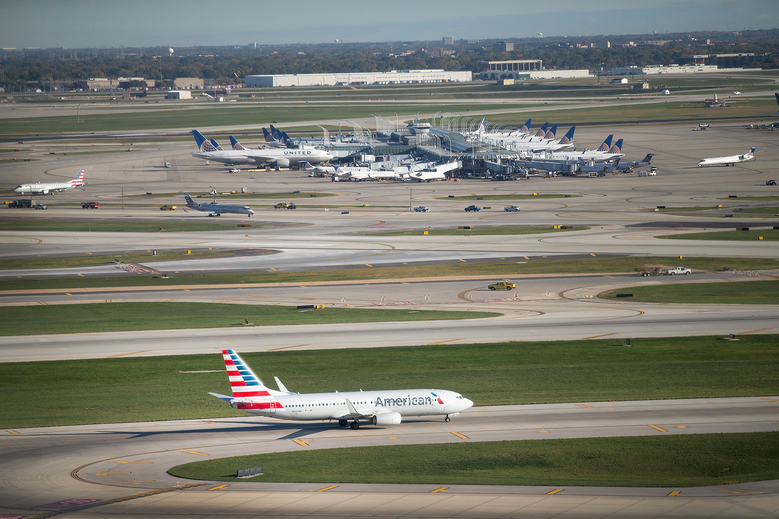 An American Airlines jet taxis below O'Hare's new Satellite South air traffic control tower on Oct. 14, 2015, in Chicago, Illinois. The 209-foot tower will manage air traffic for O'Hare's new 10R/28L runway.