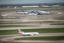 An American Airlines jet taxis below O'Hare's new Satellite South air traffic control tower on Oct. 14, 2015, in Chicago, Illinois. The 209-foot tower will manage air traffic for O'Hare's new 10R/28L runway. An American Airlines jet taxis below O'Hare's new Satellite South air traffic control tower on Oct. 14, 2015, in Chicago, Illinois. The 209-foot tower will manage air traffic for O'Hare's new 10R/28L runway.