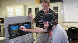 Professor Neil Fulbright, director of Avionics &amp; Cybertechnology at Embry-Riddle&rsquo;s Daytona Beach Campus, works with an aviation line maintenance student in the Avionics Laboratory.