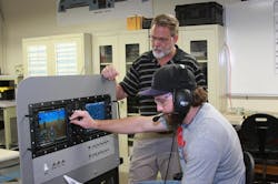 Professor Neil Fulbright, director of Avionics & Cybertechnology at Embry-Riddle’s Daytona Beach Campus, works with an aviation line maintenance student in the Avionics Laboratory. Professor Neil Fulbright, director of Avionics & Cybertechnology at Embry-Riddle’s Daytona Beach Campus, works with an aviation line maintenance student in the Avionics Laboratory.