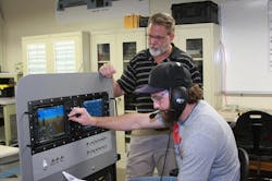 Professor Neil Fulbright, director of Avionics &amp; Cybertechnology at Embry-Riddle&rsquo;s Daytona Beach Campus, works with an aviation line maintenance student in the Avionics Laboratory.