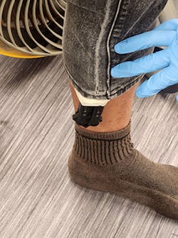 Butterfly knife taped to ankle. Butterfly knife taped to ankle.