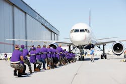 Members of the Mile High Ques participate in pulling a 125,000-pound Delta 757-200 aircraft for about 25 feet during the Delta Jet Drag event to benefit the American Cancer Society on Wednesday, May 3, 2023. The popular event attracted about 150 teams of Delta employees. Members of the Mile High Ques participate in pulling a 125,000-pound Delta 757-200 aircraft for about 25 feet during the Delta Jet Drag event to benefit the American Cancer Society on Wednesday, May 3, 2023. The popular event attracted about 150 teams of Delta employees.