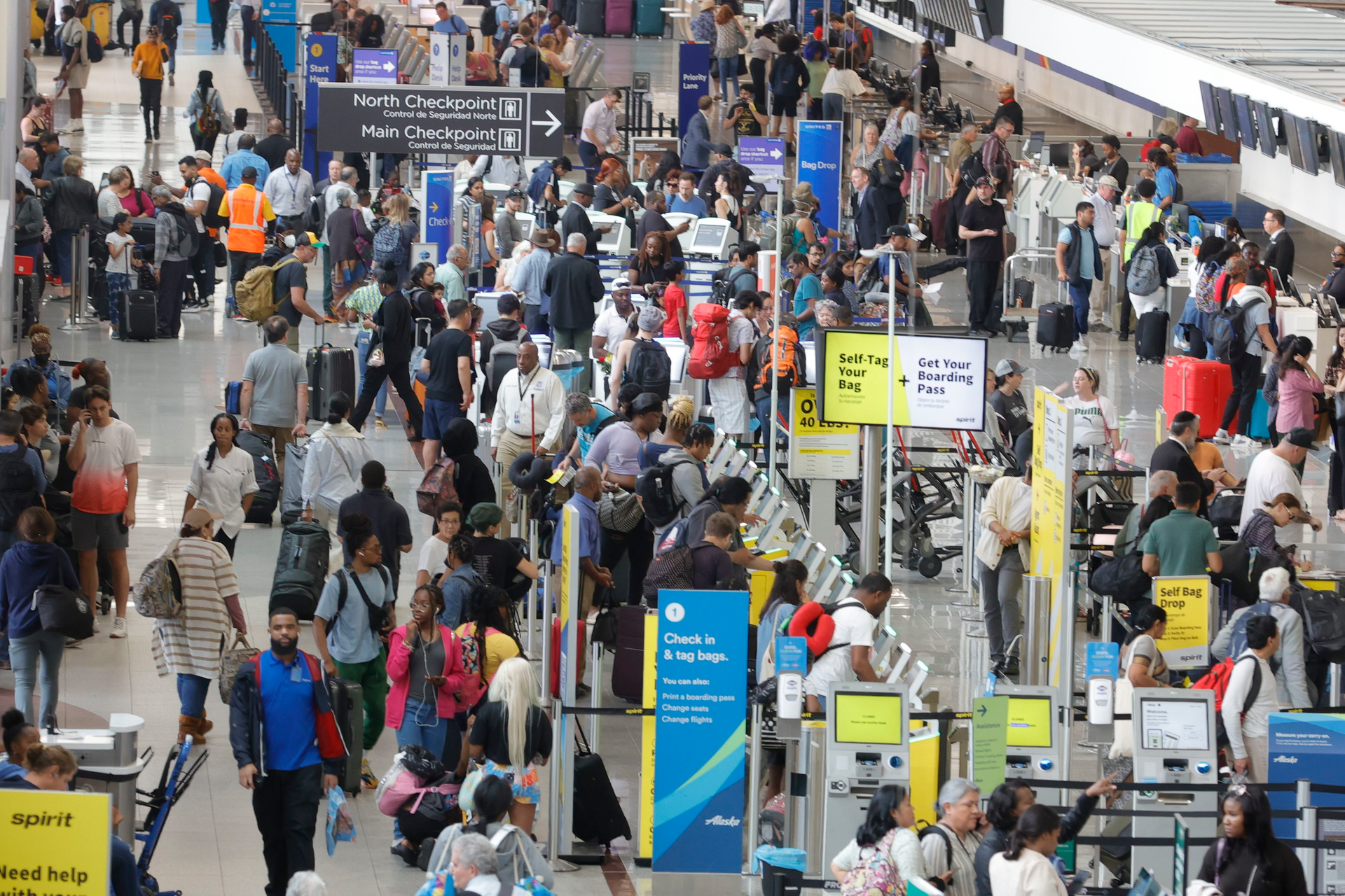 Travelers walk through Terminal North of Hartsfield-Jackson International Airport in Atlanta on Tuesday, May 9, 2023.
