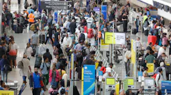 Travelers walk through Terminal North of Hartsfield-Jackson International Airport in Atlanta on Tuesday, May 9, 2023.
