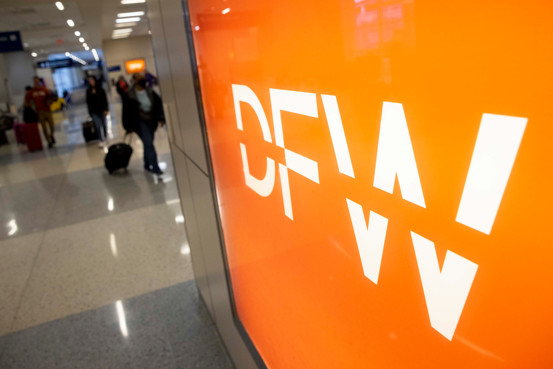 Passengers walk around Terminal D at Dallas/Fort Worth International Airport on Wednesday, March 8, 2023. DFW Airport was selected for the 2022 Airport Service Quality (ASQ) award for Best Airport.