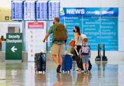 A family heads to the security check at John Wayne Airport in Santa Ana, CA on Wednesday, June 30, 2021. Free from most of the COVID-19 restrictions, many people are traveling and taking advantage of the long July 4th weekend. A family heads to the security check at John Wayne Airport in Santa Ana, CA on Wednesday, June 30, 2021. Free from most of the COVID-19 restrictions, many people are traveling and taking advantage of the long July 4th weekend.