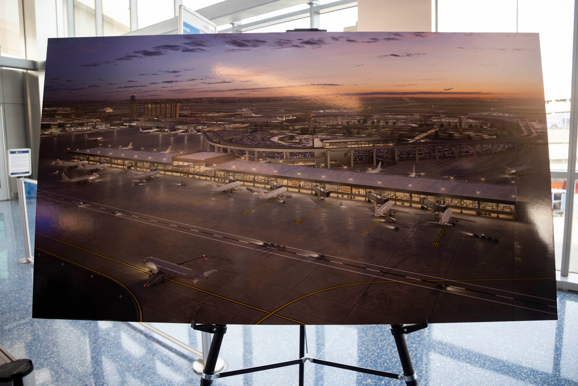 A rendering of the planned Terminal F during a press conference at Terminal C in DFW International Airport on Tuesday, May 16, 2023. DFW International Airport and American Airlines have come to a deal for $4.8 billion in expansions, including $1.6 billion for the new terminal that would include 15 new gates.