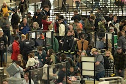 People move through a security checkpoint at Denver International Airport on Thursday, Dec. 22, 2022. People move through a security checkpoint at Denver International Airport on Thursday, Dec. 22, 2022.