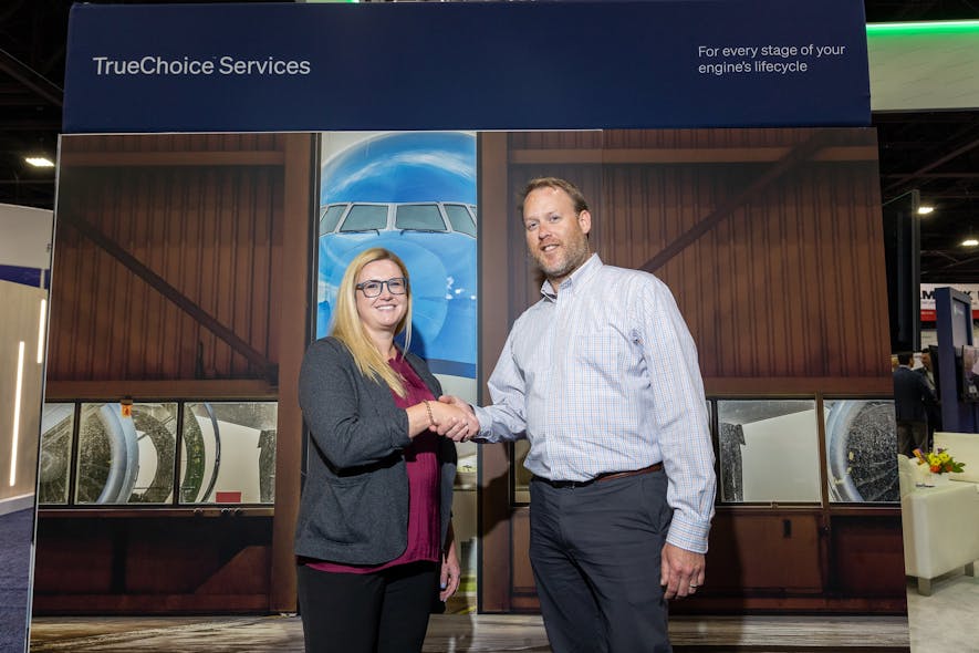 Nicole Tibbetts, Chief Manufacturing Engineer for MRO at GE Aerospace, and Michael Domke, General Manager Visual at Waygate Technologies, shake hands to mark the signing of the agreement.