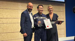 Hactl Chief Executive Wilson Kwong (center) receives the award from Thilo Schmid, CEO, Cologne Bonn Airport (left).